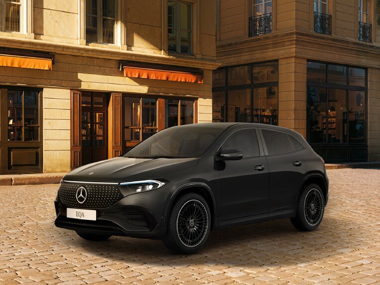 A woman sits and relaxes in the driving seat of her parked Mercedes-Benz C-Class PHEV.