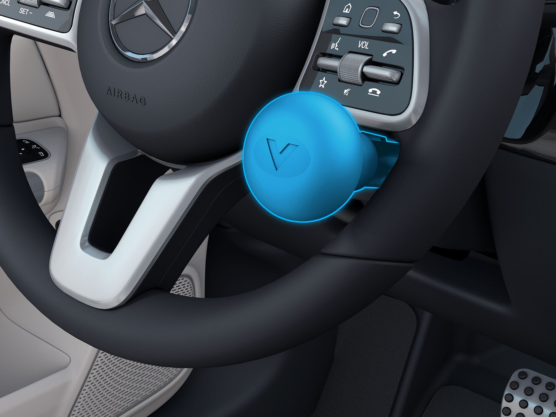 Detailní pohled na madlo na volantu vpravo v&nbsp;kombinaci s&nbsp;vozidlem vhodným pro invalidy.